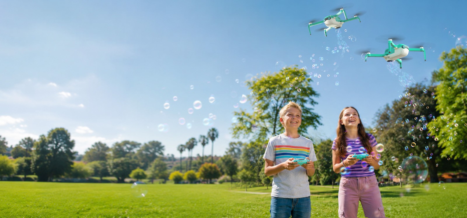 Kids flying HS320 bubble drones outdoors in a sunny park